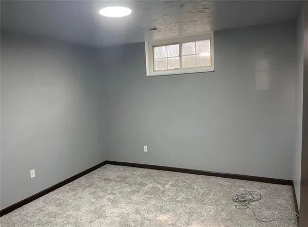 an empty room with closet and door