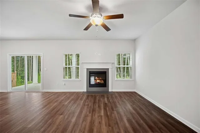 a kitchen with a refrigerator and a stove top oven