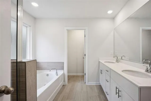 a bathroom with a bathtub and a shower