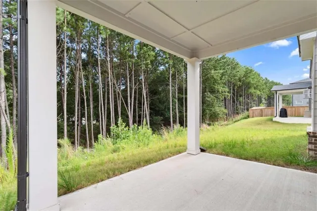 a view of a house with a backyard