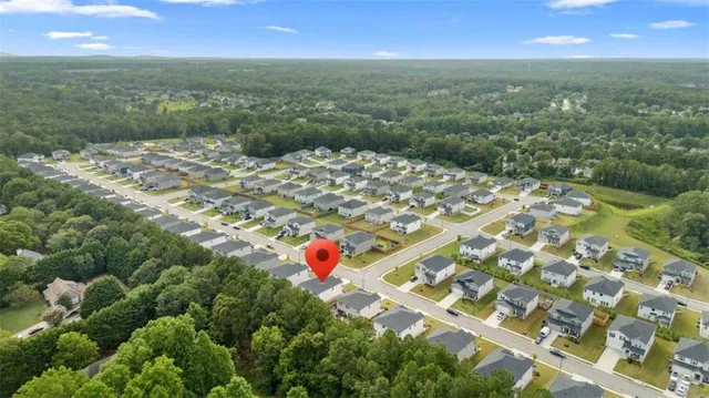an aerial view of residential houses with outdoor space