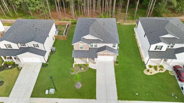 swimming pool view with a backyard space