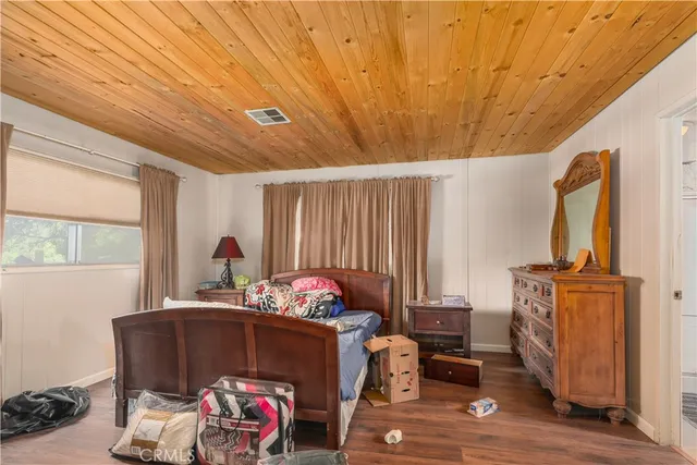 a bedroom with furniture and a window