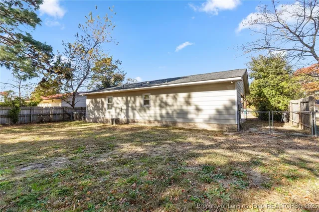a view of big yard with a house