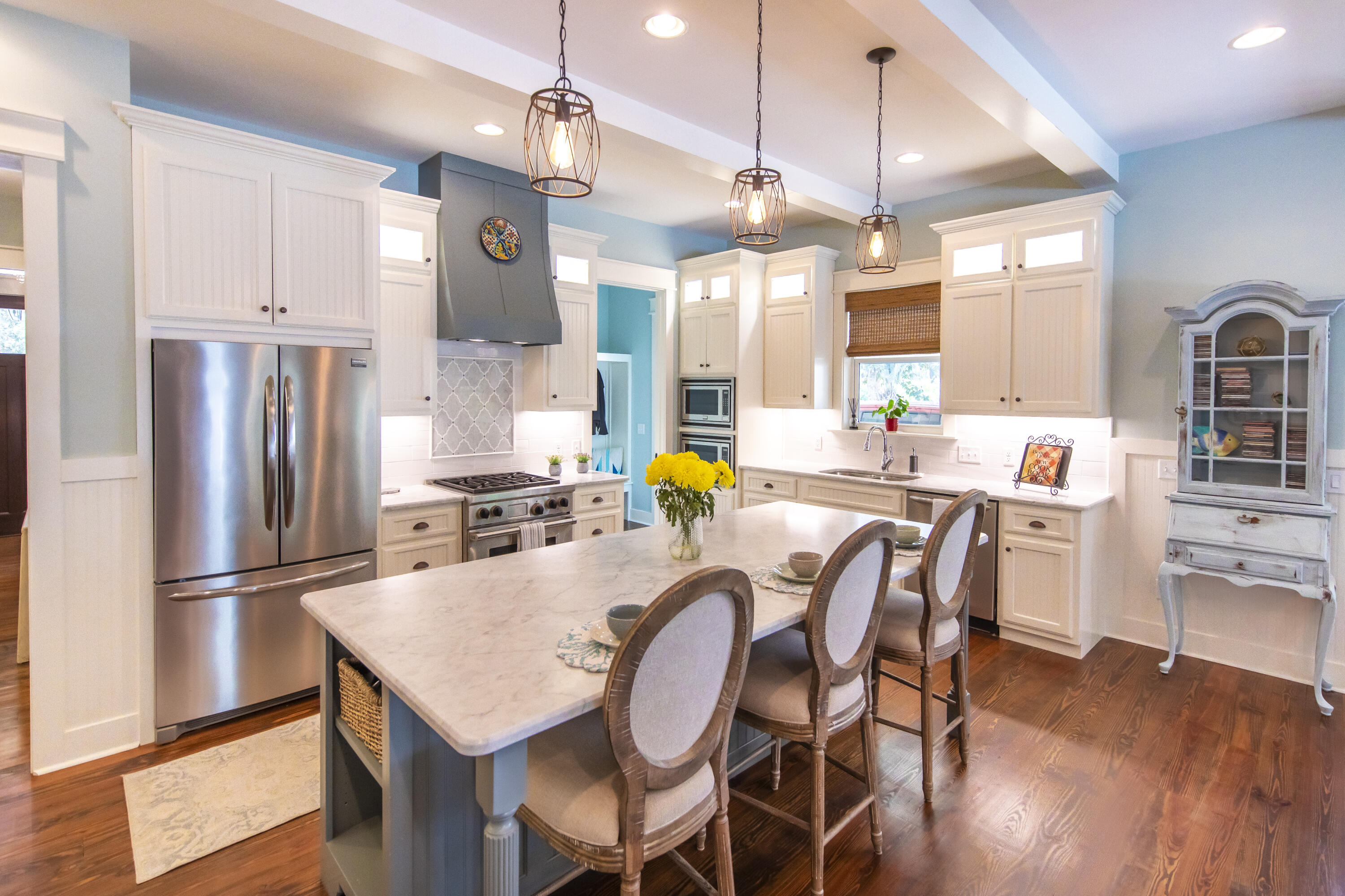 491 North Orange Street Inlet Beach, FL 32461 - Photo 14 of 65 a large kitchen with a table chairs refrigerator and cabinets
