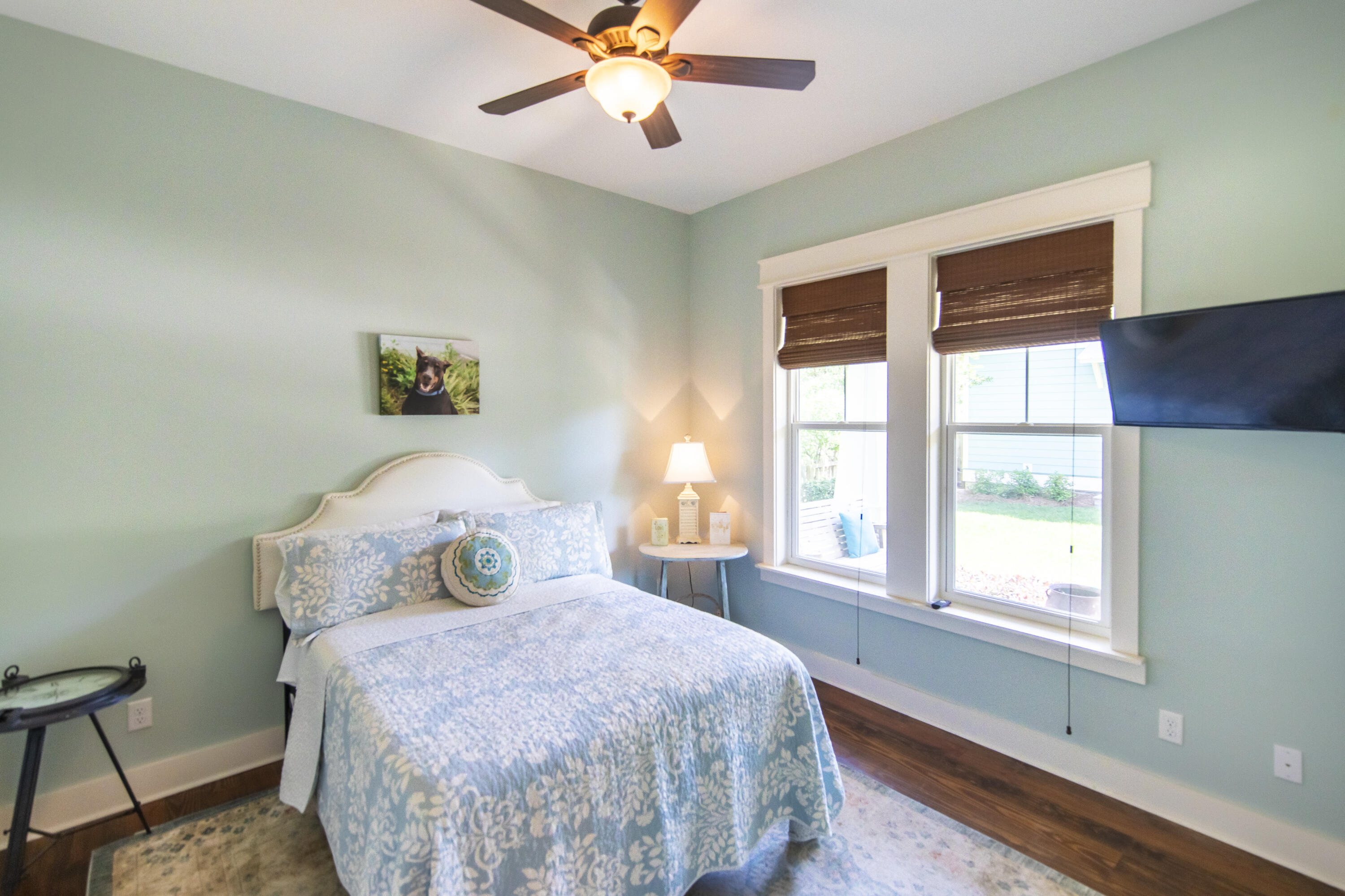 491 North Orange Street Inlet Beach, FL 32461 - Photo 17 of 65 a bedroom with a bed and wooden floor