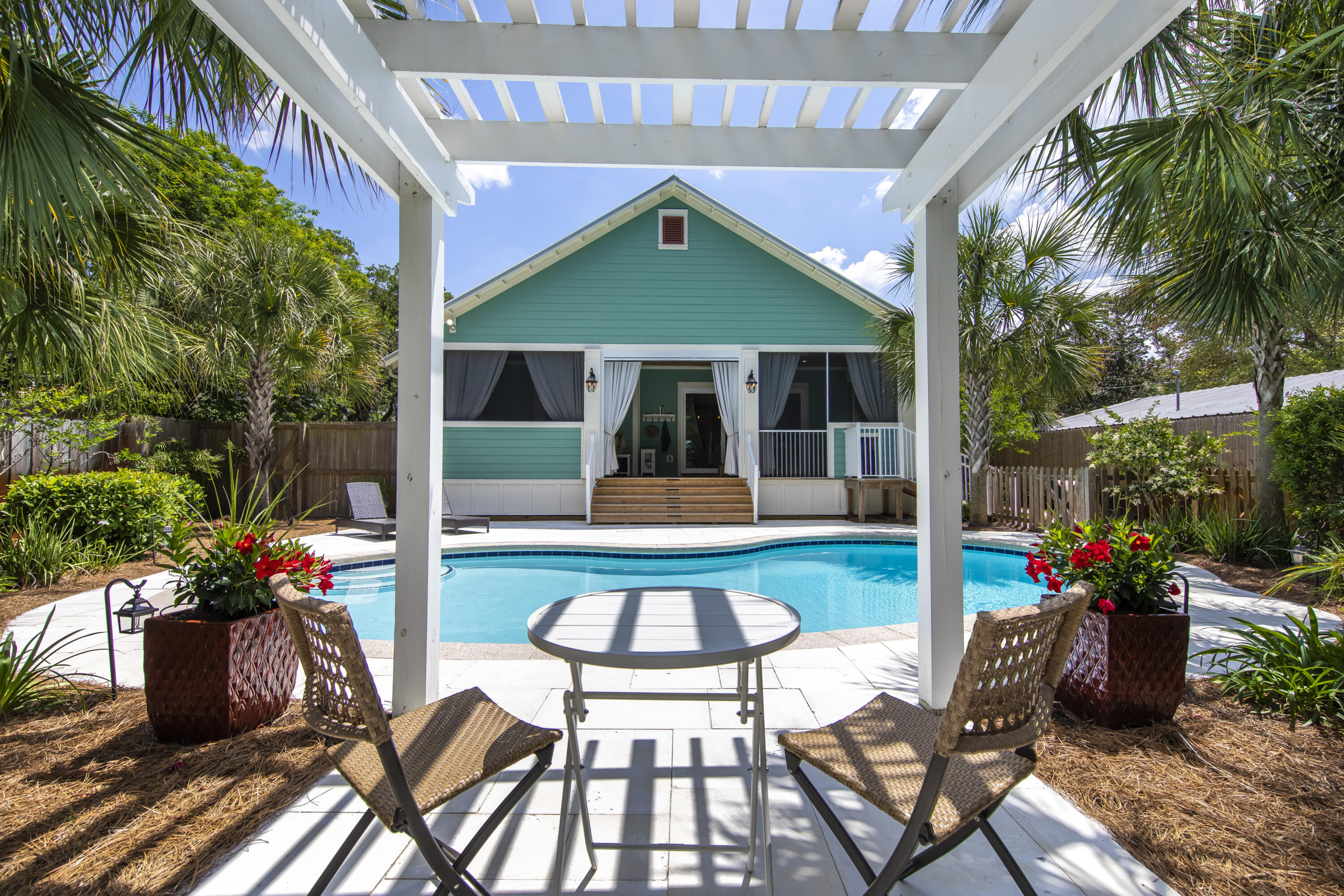 491 North Orange Street Inlet Beach, FL 32461 - Photo 30 of 65 a view of a house with backyard sitting area and garden