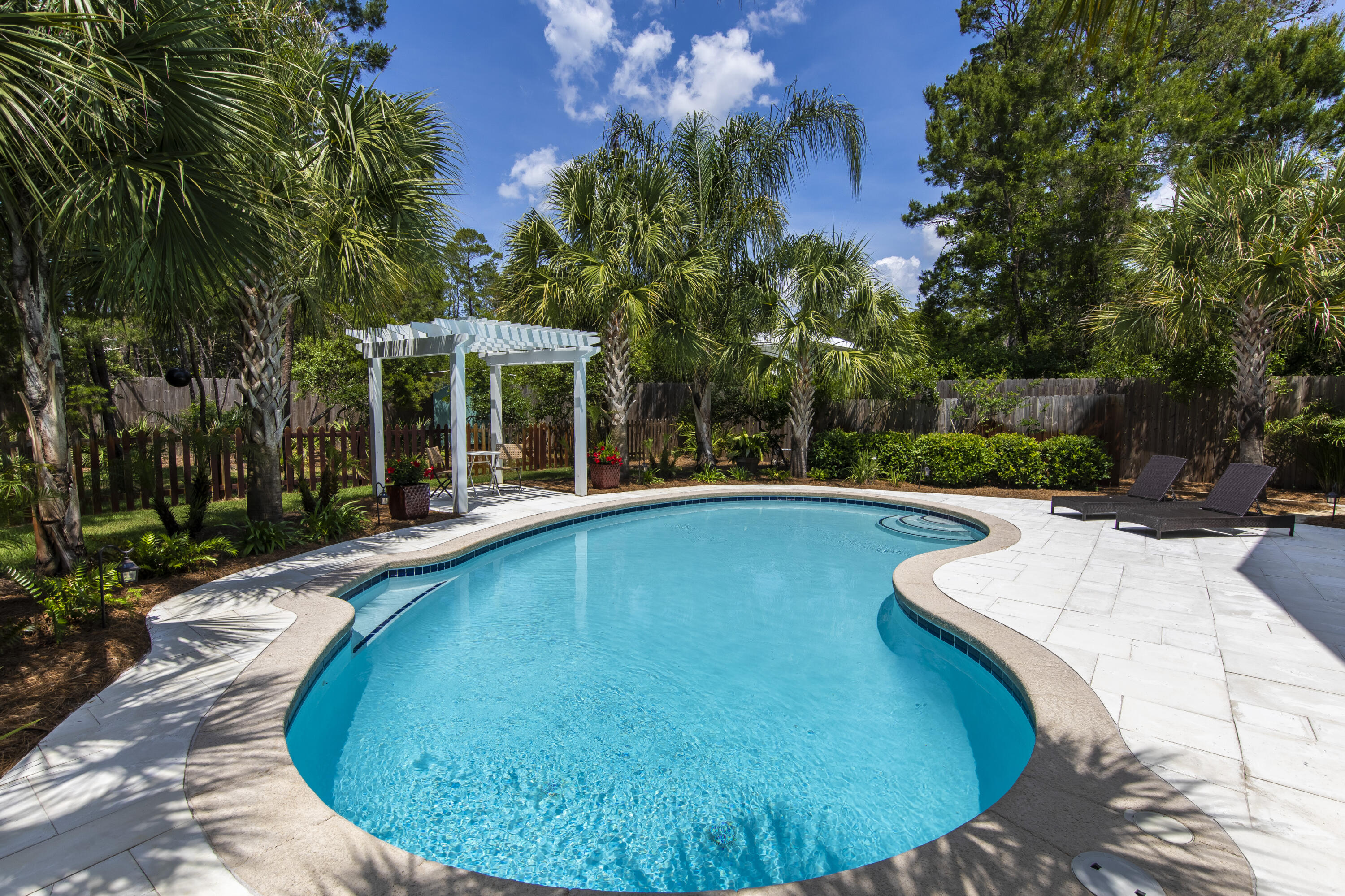 491 North Orange Street Inlet Beach, FL 32461 - Photo 34 of 65 a view of a swimming pool with an outdoor space and seating area