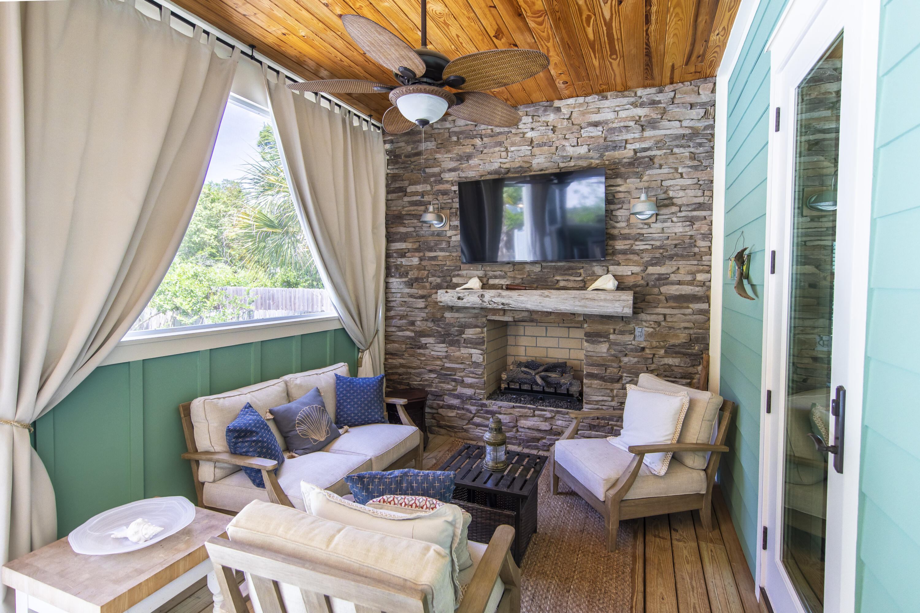 491 North Orange Street Inlet Beach, FL 32461 - Photo 38 of 65 a balcony with furniture and a fireplace