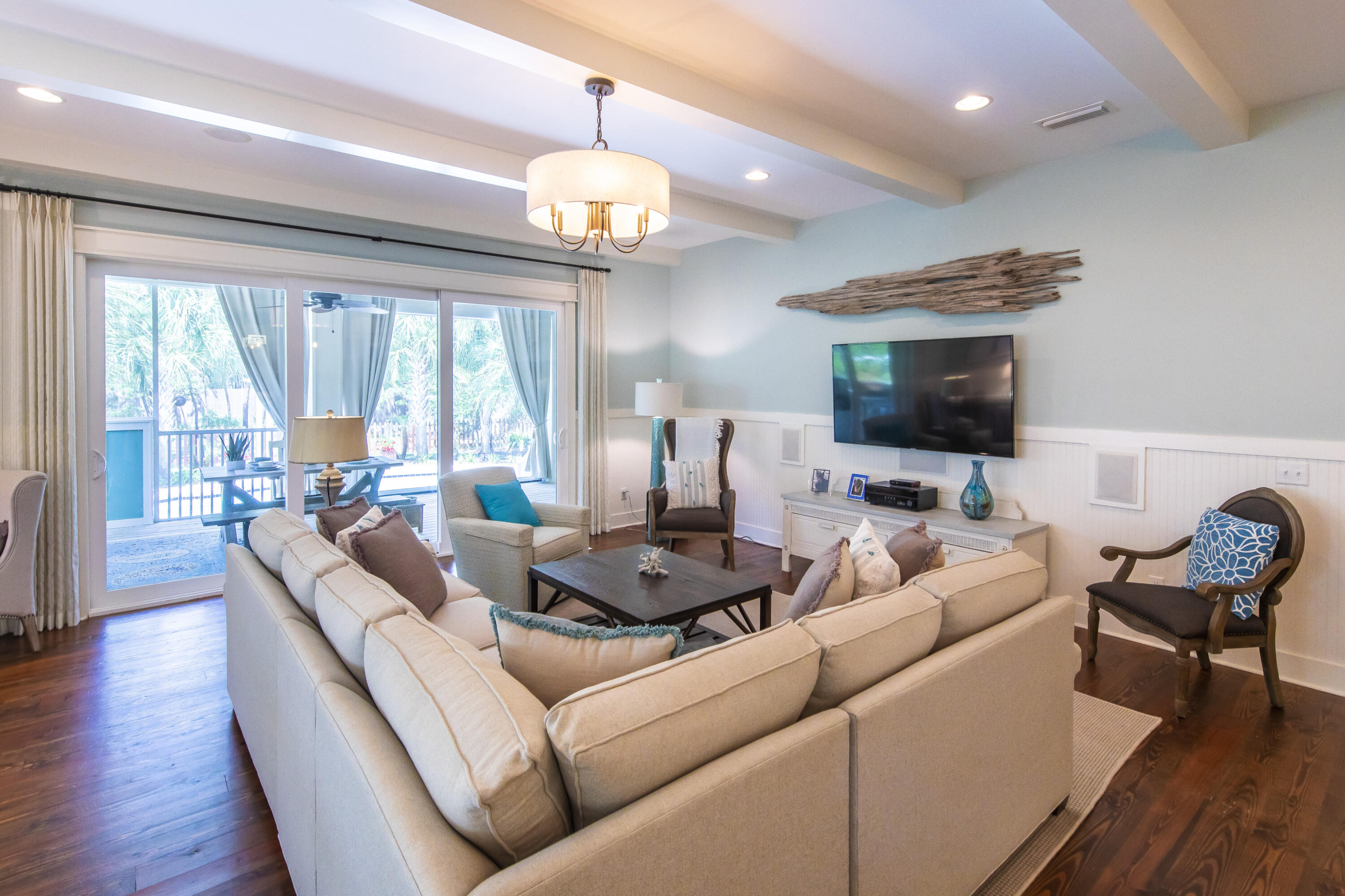 491 North Orange Street Inlet Beach, FL 32461 - Photo 40 of 65 a living room with furniture and a flat screen tv