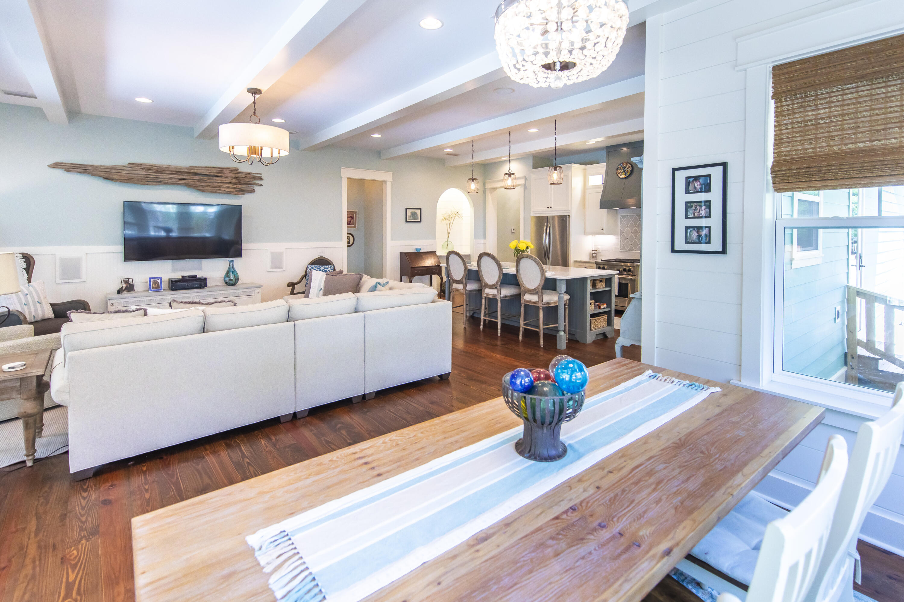 491 North Orange Street Inlet Beach, FL 32461 - Photo 43 of 65 a living room with kitchen island furniture and a chandelier