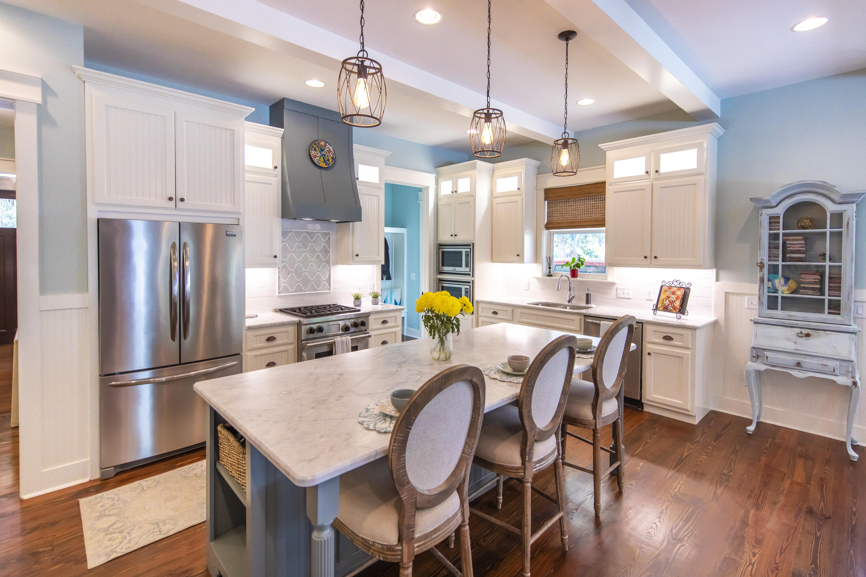 491 North Orange Street Inlet Beach, FL 32461 - Photo 46 of 65 a large kitchen with a table chairs refrigerator and cabinets
