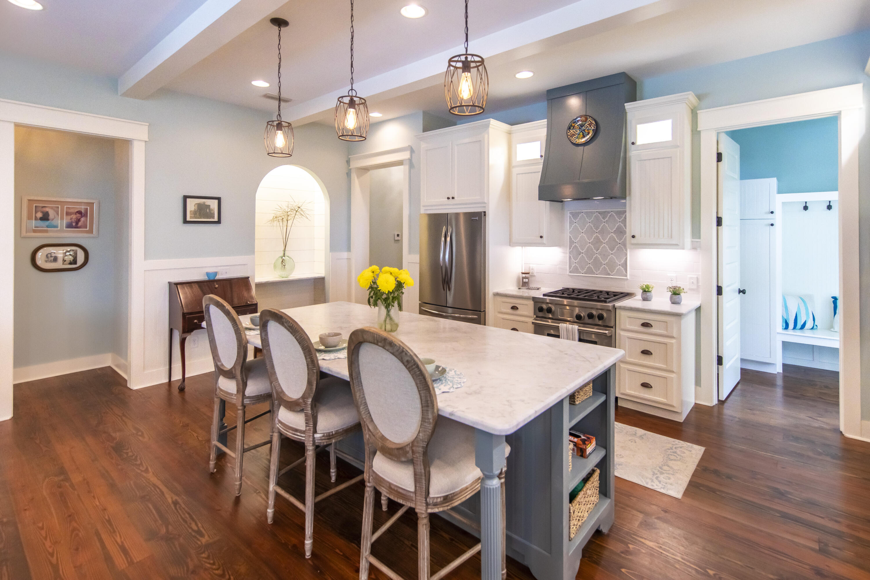 491 North Orange Street Inlet Beach, FL 32461 - Photo 47 of 65 a kitchen with a dining table chairs and stainless steel appliances