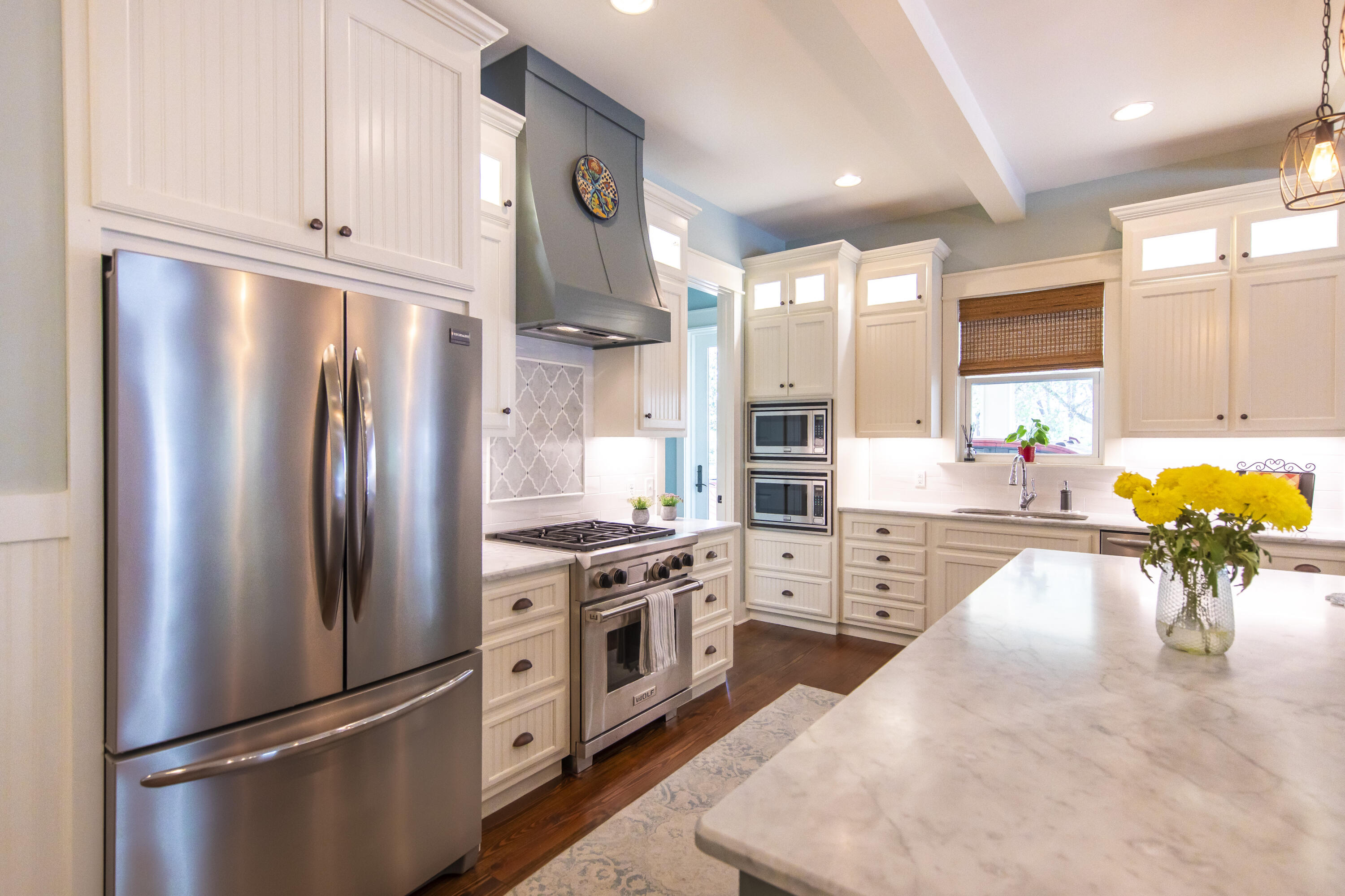 491 North Orange Street Inlet Beach, FL 32461 - Photo 48 of 65 a kitchen with stainless steel appliances a refrigerator sink and stove