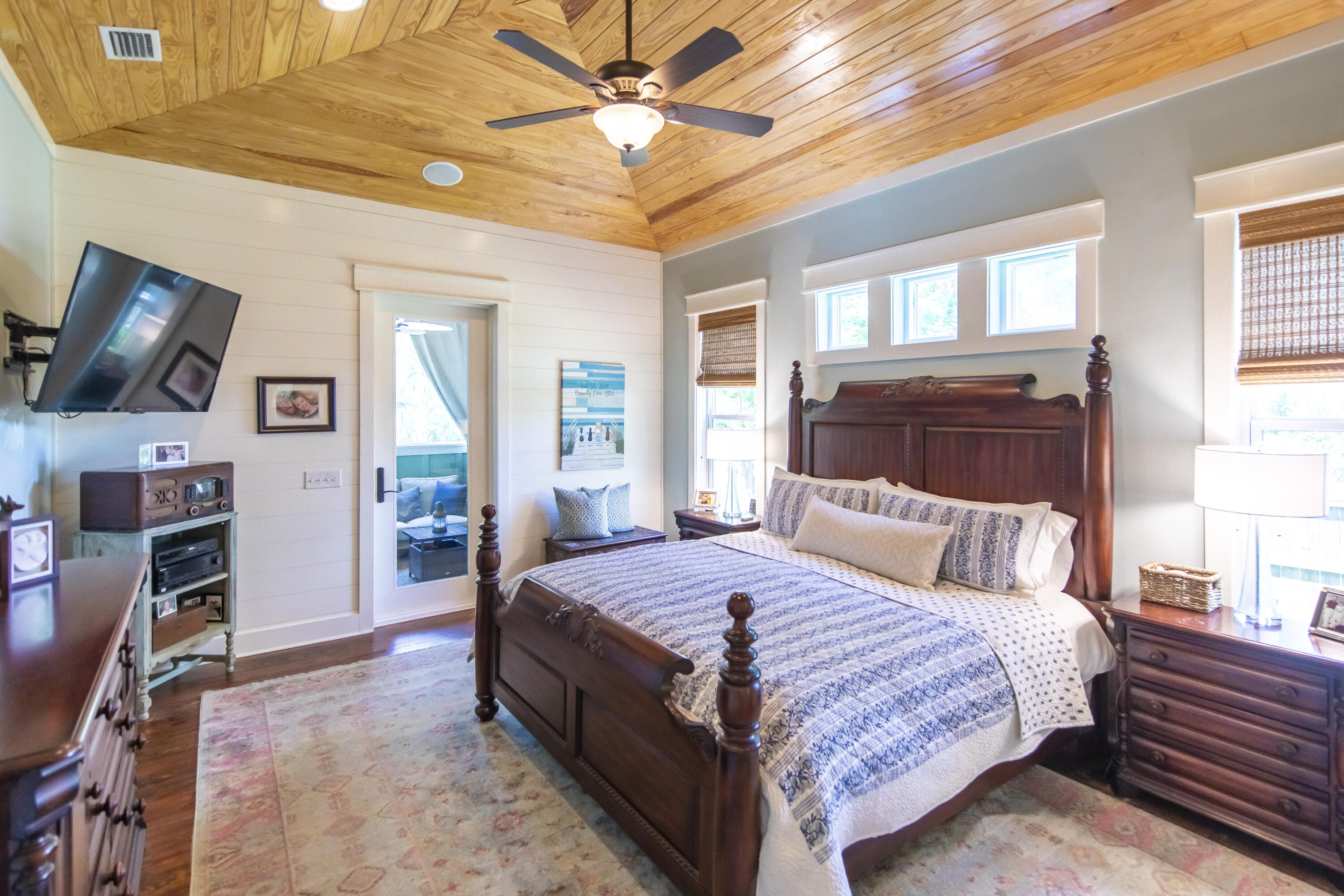 491 North Orange Street Inlet Beach, FL 32461 - Photo 52 of 65 a bedroom with a bed and a chandelier