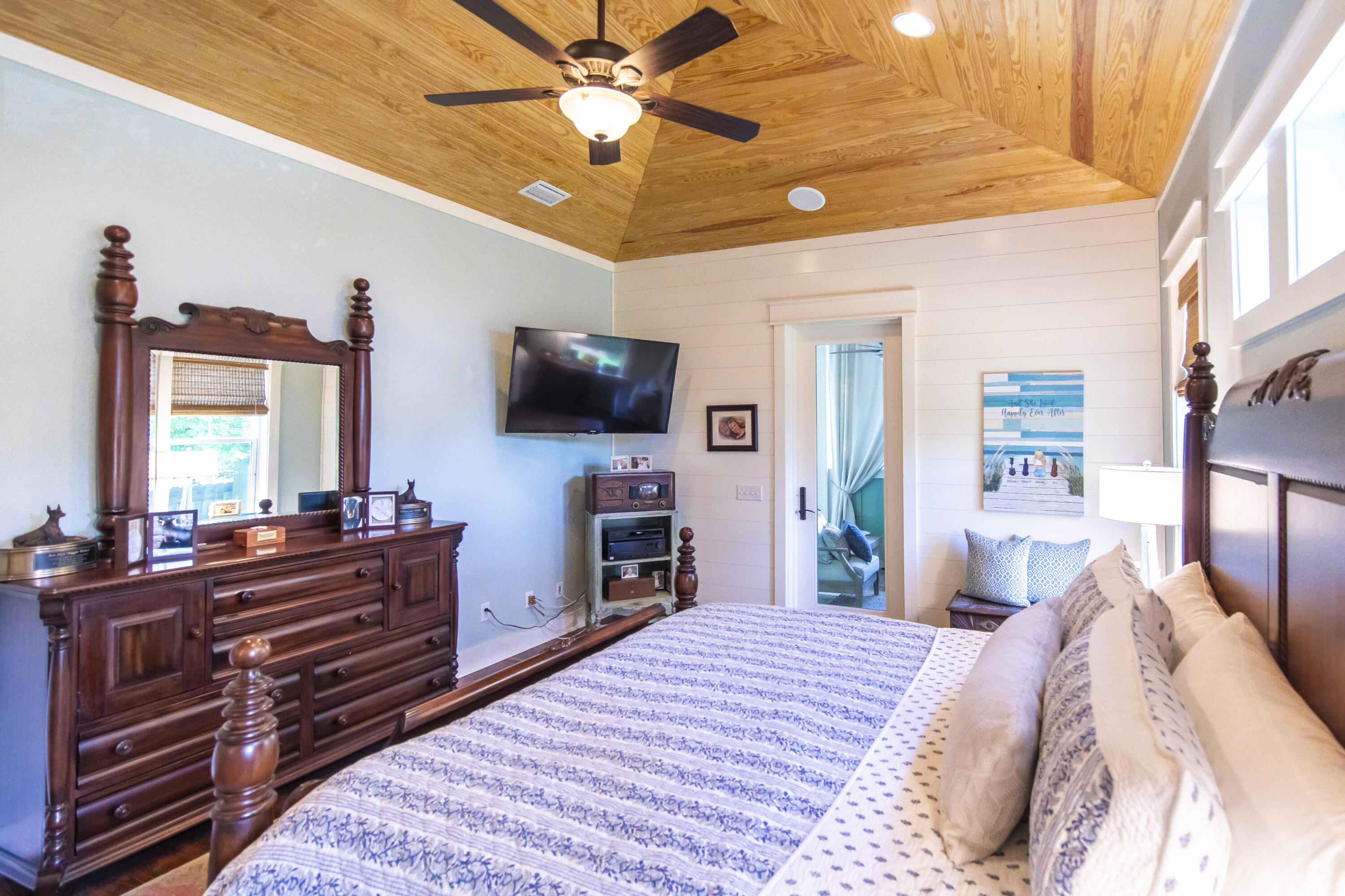 491 North Orange Street Inlet Beach, FL 32461 - Photo 53 of 65 a bedroom with a bed and a flat tv screen on dresser