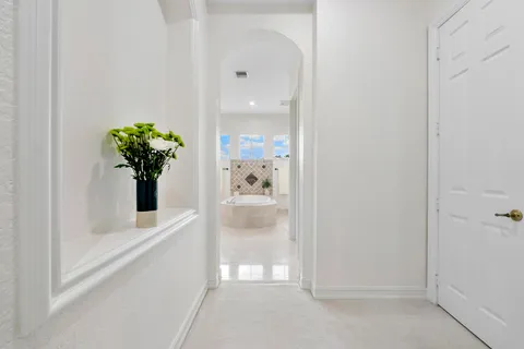 a bathroom with a granite countertop sink a toilet and a bathtub