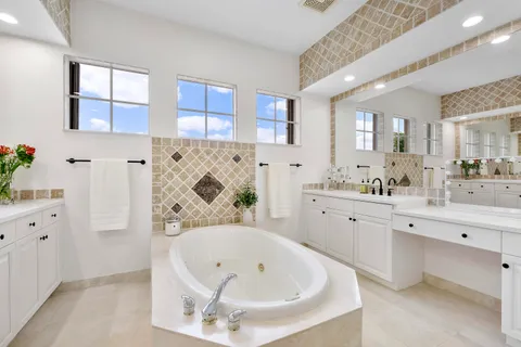 a bathroom with a granite countertop sink a toilet and shower