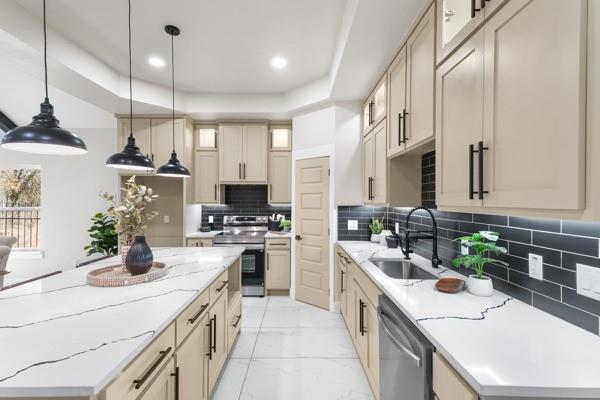 a kitchen with a sink stove and refrigerator
