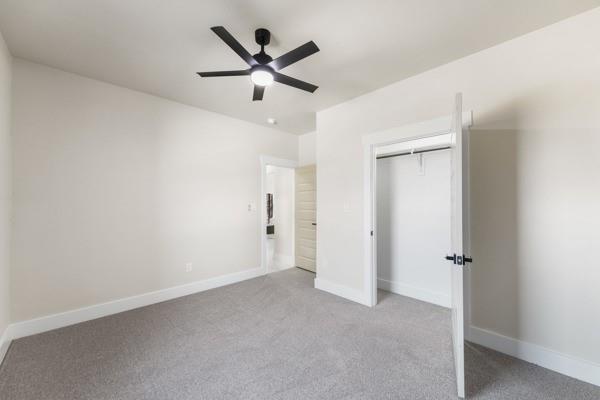 508 Luzon Street Tool, TX 75143 - Photo 20 of 40 an empty room with ceiling fan and windows