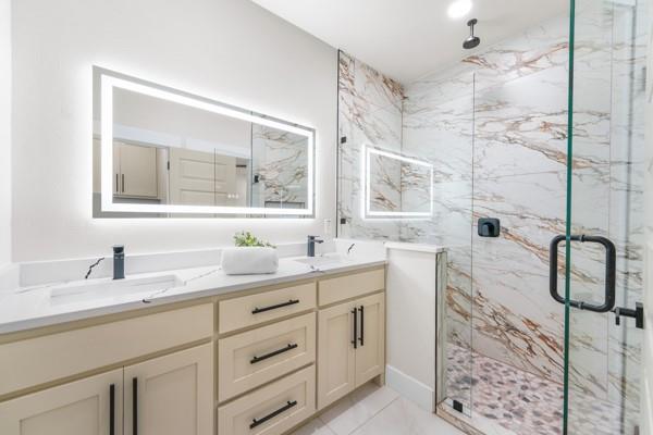 508 Luzon Street Tool, TX 75143 - Photo 23 of 40 a bathroom with a double vanity sink mirror and shower