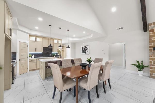 508 Luzon Street Tool, TX 75143 - Photo 7 of 40 a view of kitchen with refrigerator dining table and chairs