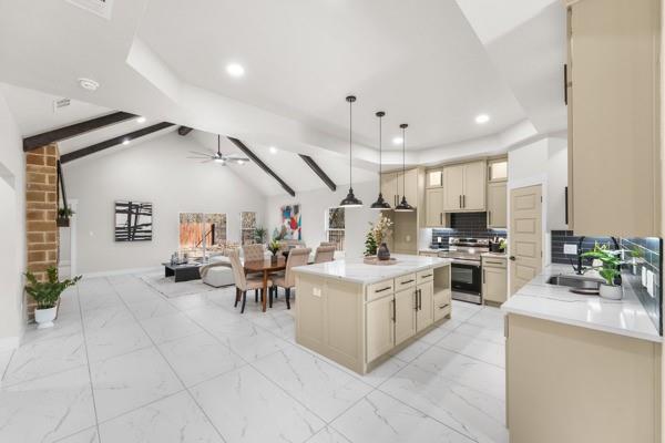 508 Luzon Street Tool, TX 75143 - Photo 8 of 40 a white kitchen with cabinets and stainless steel appliances