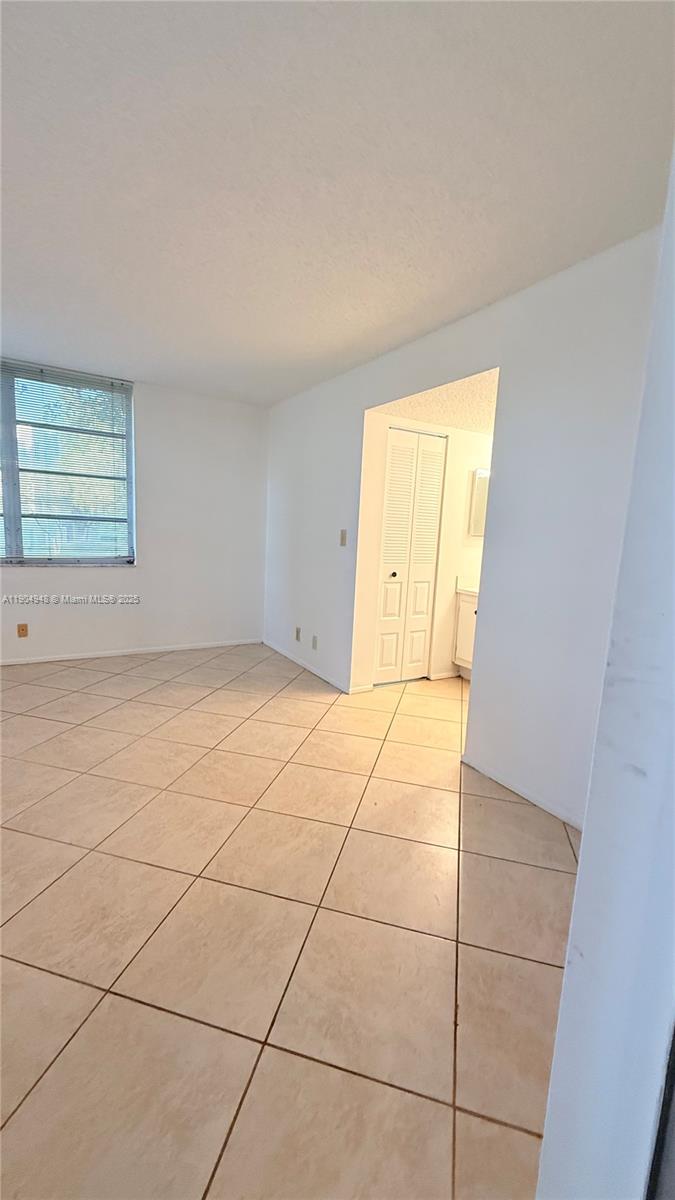 1811 Sabal Palm Drive, Unit 208 Davie, FL 33324 - Photo 12 of 28 a view of an empty room with a window