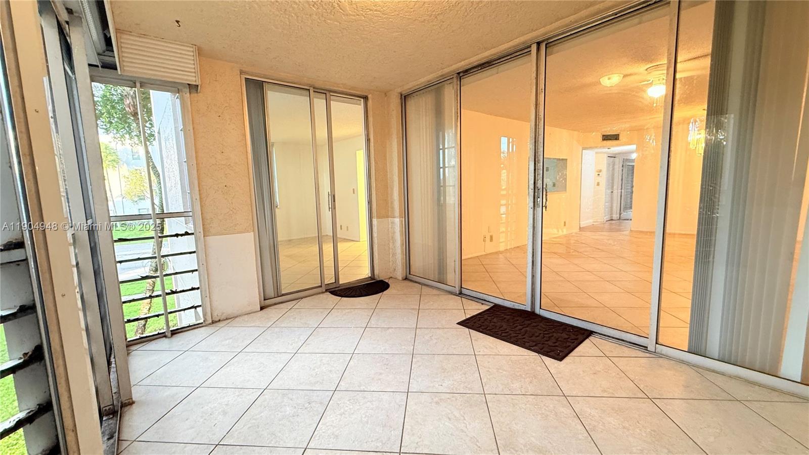 1811 Sabal Palm Drive, Unit 208 Davie, FL 33324 - Photo 16 of 28 a view of an empty room and window