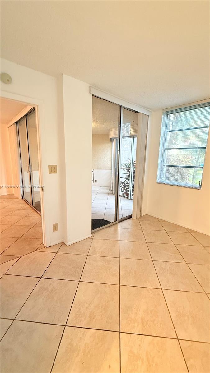 1811 Sabal Palm Drive, Unit 208 Davie, FL 33324 - Photo 17 of 28 a view of a empty room with a fireplace