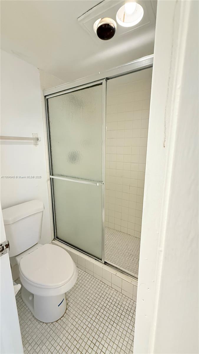 1811 Sabal Palm Drive, Unit 208 Davie, FL 33324 - Photo 18 of 28 a bathroom with a toilet and a shower