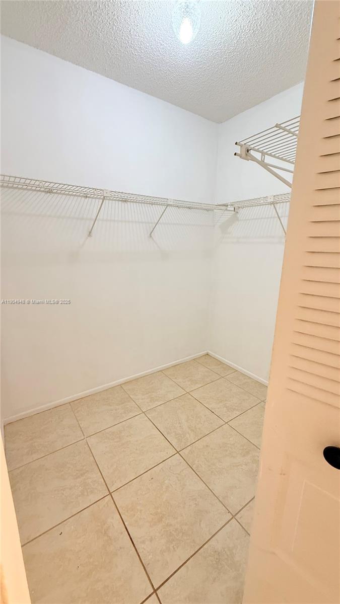 1811 Sabal Palm Drive, Unit 208 Davie, FL 33324 - Photo 20 of 28 a view of a room with racks on the wall
