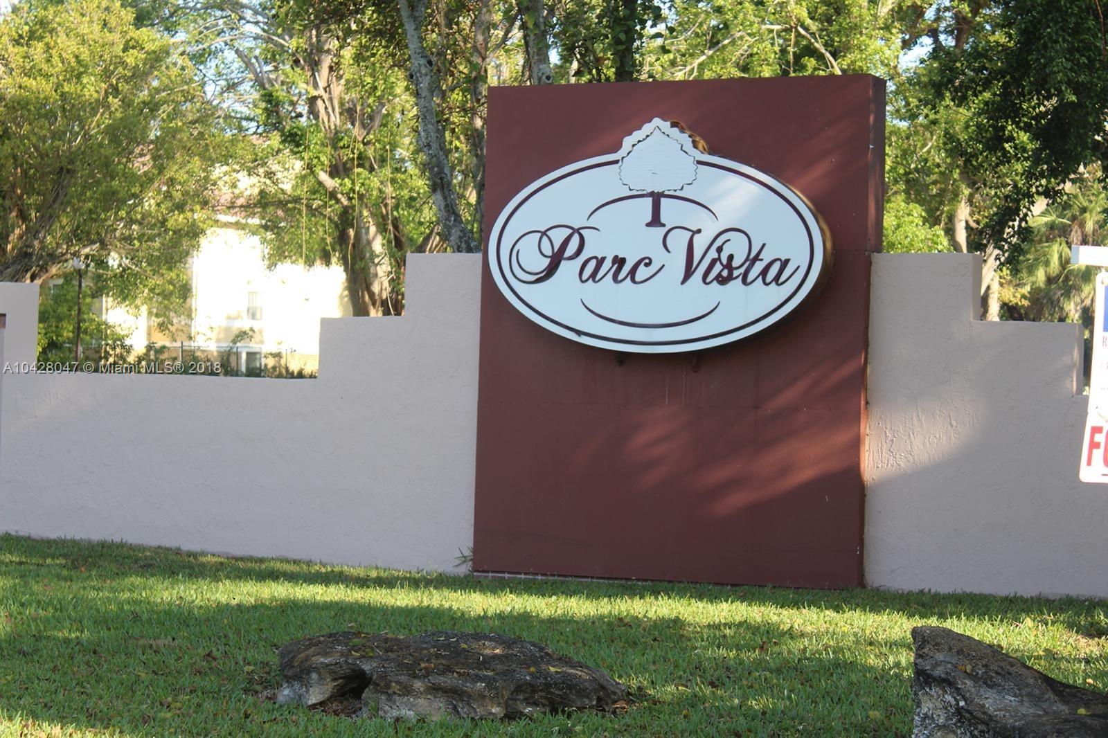 9511 Southwest 138th Place, Unit 9511 Miami, FL 33186 - Photo 1 of 17 a backyard of a house with lots of green space