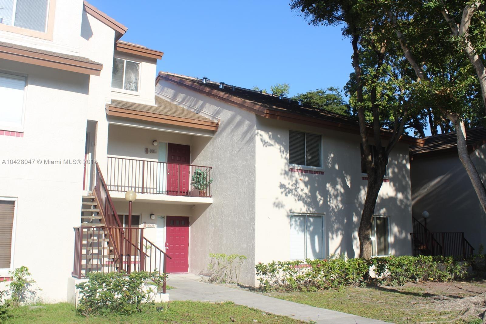 9511 Southwest 138th Place, Unit 9511 Miami, FL 33186 - Photo 4 of 17 a front view of a house