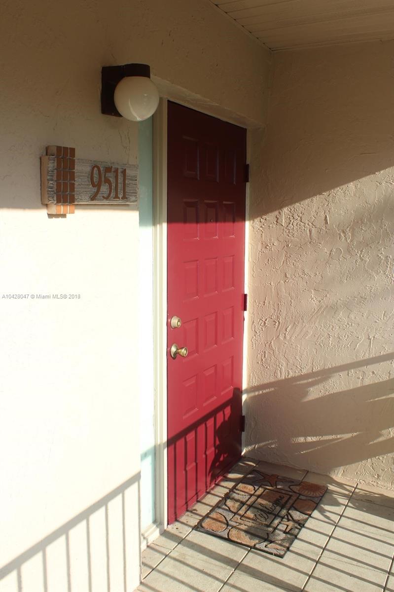 9511 Southwest 138th Place, Unit 9511 Miami, FL 33186 - Photo 5 of 17 a view of hallway