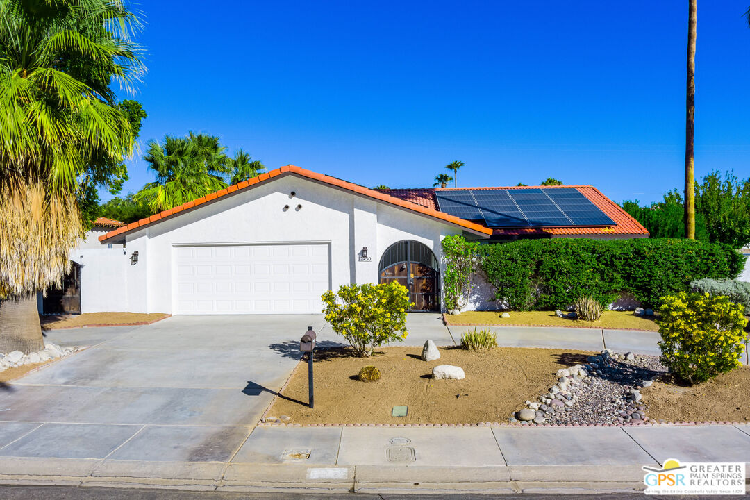 2750 East Vincentia Road Palm Springs, CA 92262 - Photo 1 of 55 a view of a house with backyard and sitting area