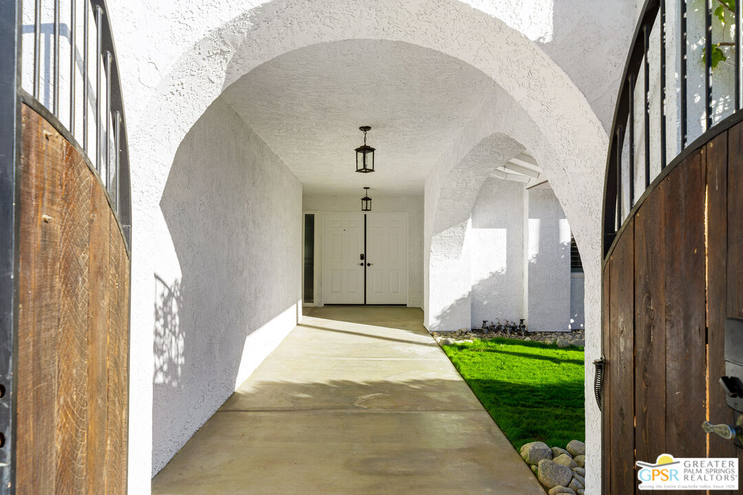 2750 East Vincentia Road Palm Springs, CA 92262 - Photo 14 of 55 a front view of a house with a yard
