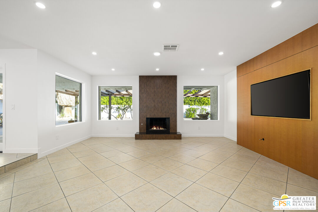2750 East Vincentia Road Palm Springs, CA 92262 - Photo 20 of 55 a view of an empty room with a fireplace and a window