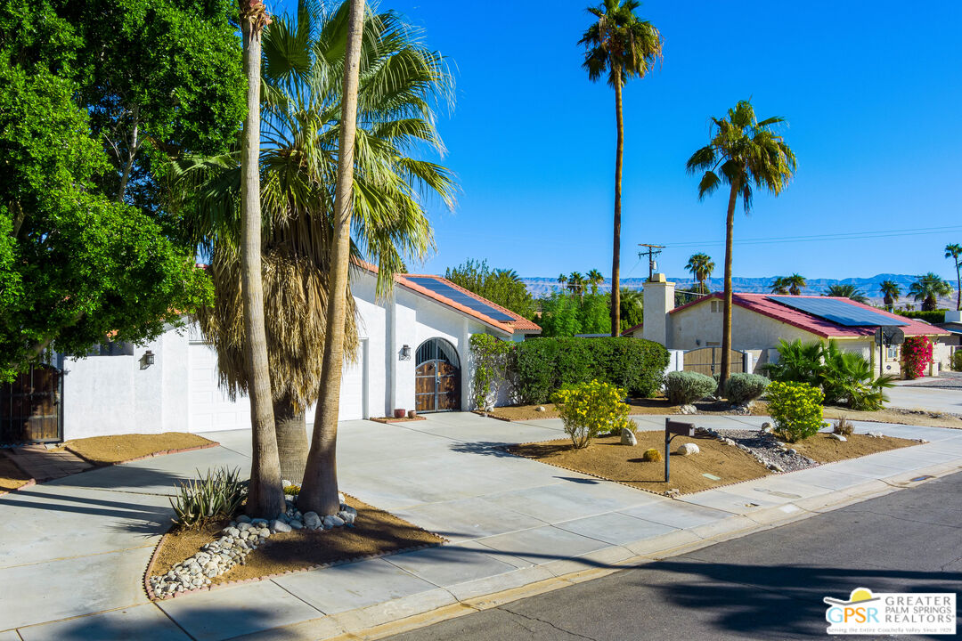 2750 East Vincentia Road Palm Springs, CA 92262 - Photo 2 of 55 a view of a building with a swimming pool