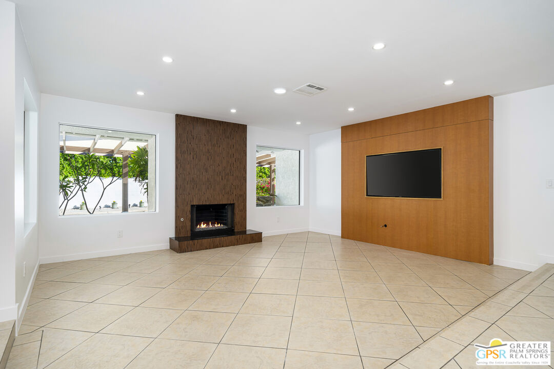 2750 East Vincentia Road Palm Springs, CA 92262 - Photo 21 of 55 a view of an empty room with a fireplace