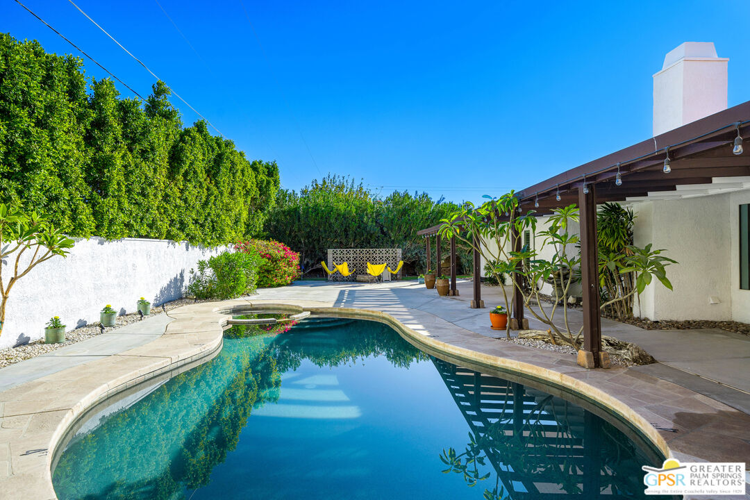 2750 East Vincentia Road Palm Springs, CA 92262 - Photo 35 of 55 a swimming pool view with a garden space