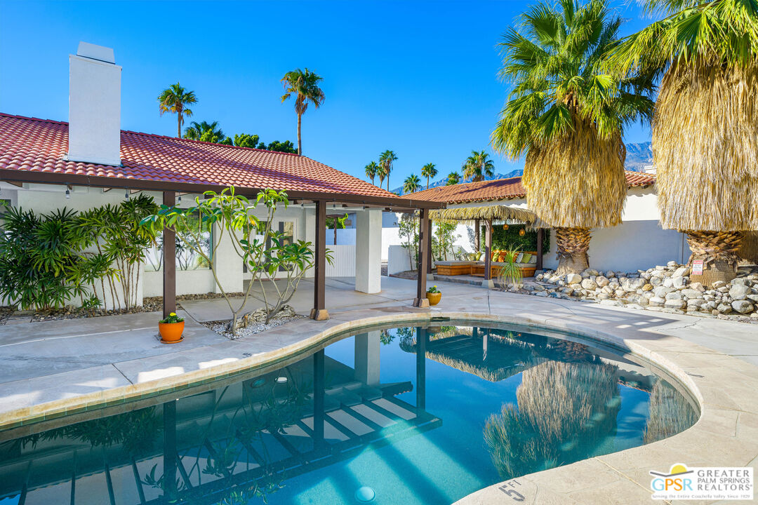 2750 East Vincentia Road Palm Springs, CA 92262 - Photo 41 of 55 a view of a swimming pool with a patio