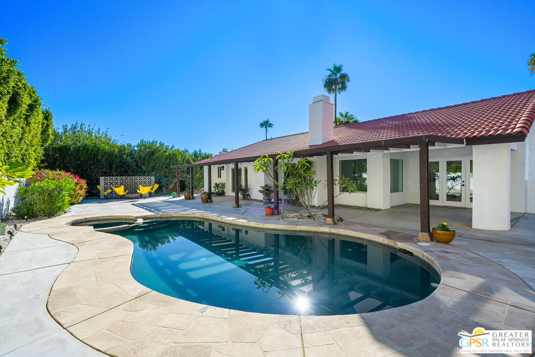 2750 East Vincentia Road Palm Springs, CA 92262 - Photo 42 of 55 a view of a house with swimming pool and sitting area