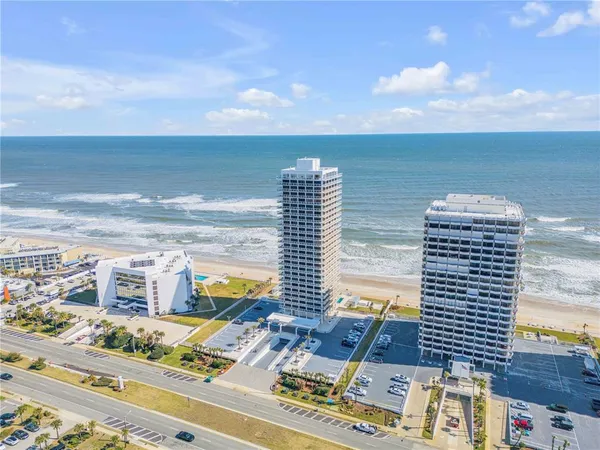 a view of a city and ocean