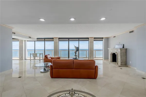 a room with a sink a mirror and a glass door shower