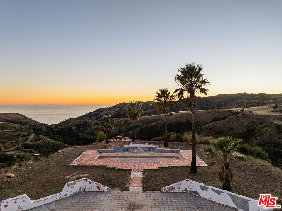 3030 Encinal Canyon Road Malibu, CA 90265 - Photo 16 of 22 a view of a swimming pool with a yard