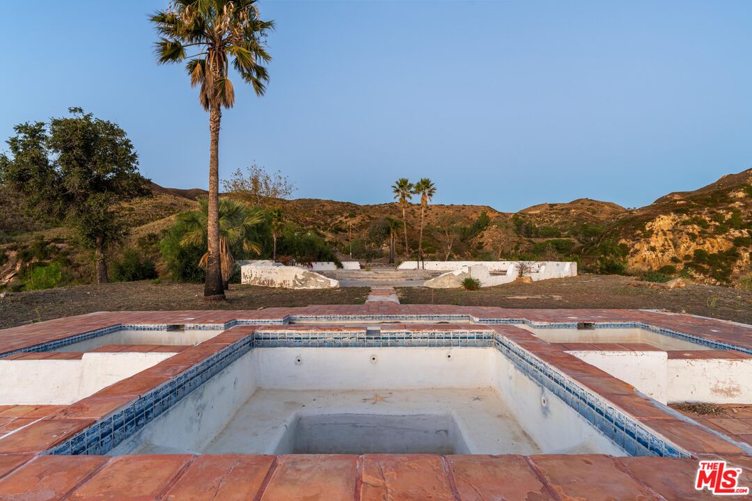 3030 Encinal Canyon Road Malibu, CA 90265 - Photo 17 of 22 a view of a swimming pool with a lake view