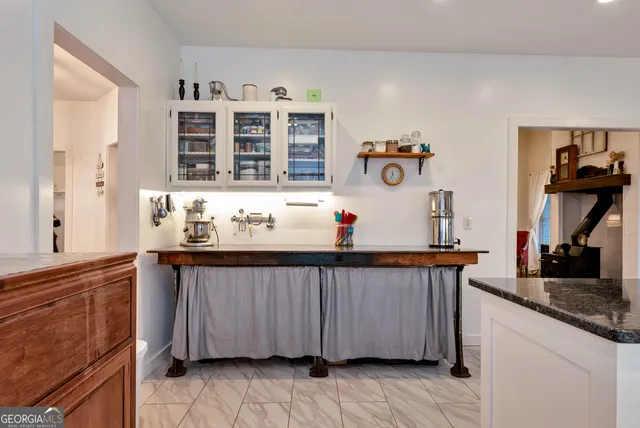 a kitchen with stainless steel appliances a stove a sink and a refrigerator