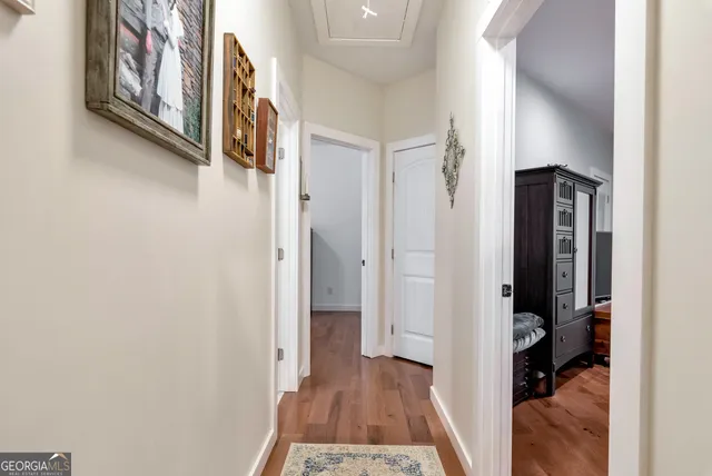 a bedroom with a bed window and a flat screen tv