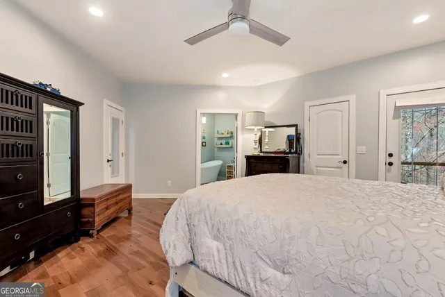 a white bath tub sitting next to a white sink